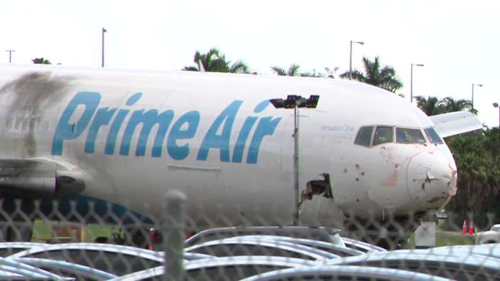 Moneywatch: AI slowdown calls and partnership pause after deadly cargo crash
